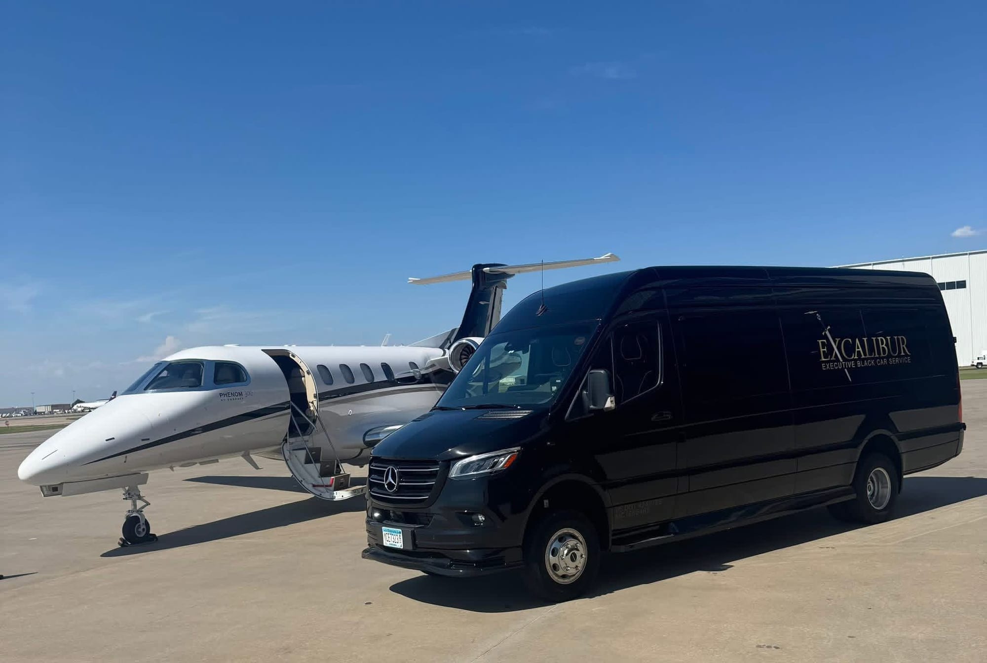 Excalibur Sprinter waiting beside a private jet on the tarmac — Excalibur airport travel guide, Oklahoma City