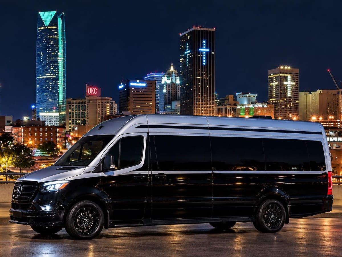 The Monarch Maybach two-tone black and silver Sprinter against the Oklahoma City skyline at night, Excalibur Executive
